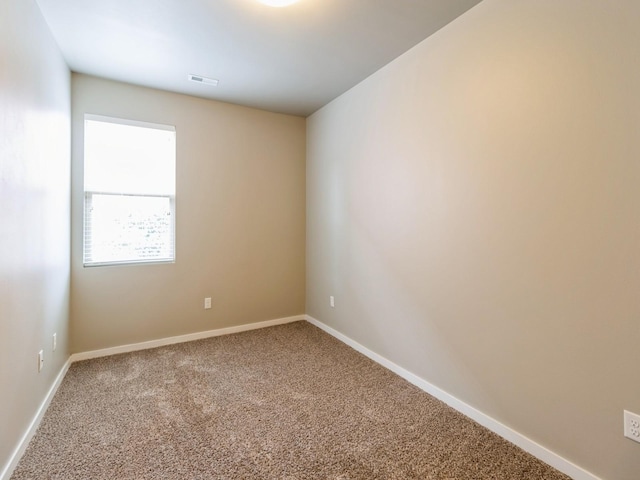 316 SW 6th St Unit 106, Des Moines, IA 50309 - empty room with carpet flooring and baseboards