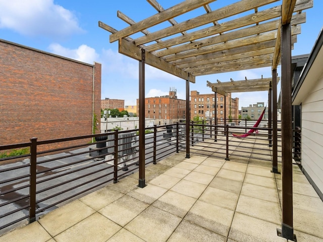316 SW 6th St Unit 106, Des Moines, IA 50309 - patio / terrace with a pergola and a city view
