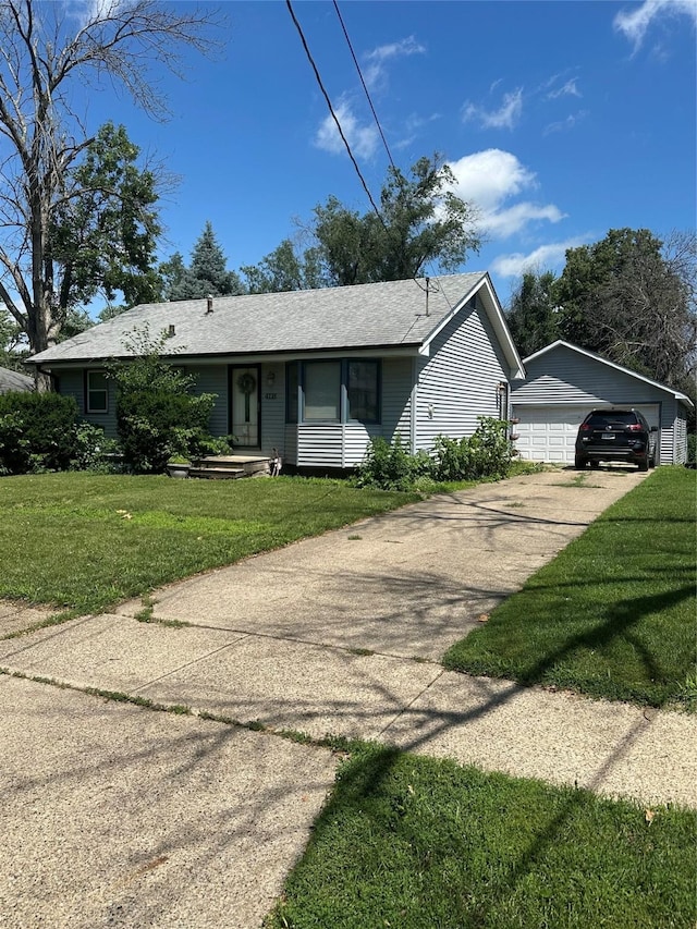 4118 E Garden Ave, Des Moines, IA 50317 - single story home with a garage, a front lawn, and an outbuilding