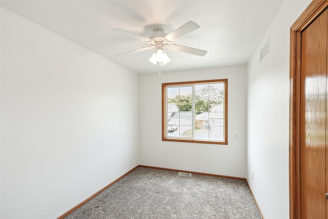 2907 E 43rd St, Des Moines, IA 50317 - spare room with carpet flooring and a ceiling fan