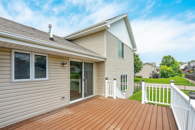2907 E 43rd St, Des Moines, IA 50317 - wooden deck featuring a lawn