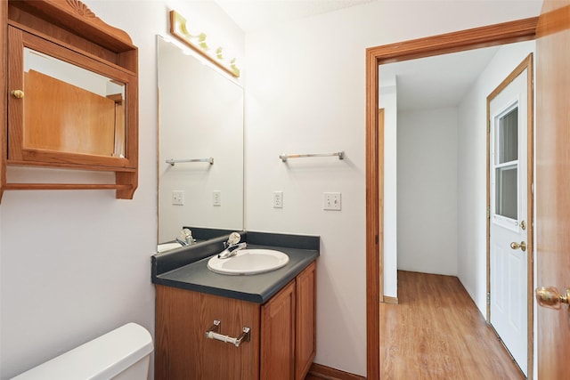 2907 E 43rd St, Des Moines, IA 50317 - half bath with wood finished floors and vanity