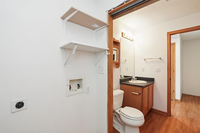 2907 E 43rd St, Des Moines, IA 50317 - bathroom featuring wood finished floors and vanity