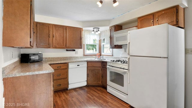 808 E 8th St S, Newton, IA 50208 - kitchen with white appliances, brown cabinetry, and dark wood-type flooring