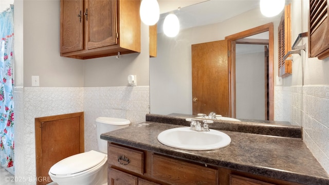 808 E 8th St S, Newton, IA 50208 - bathroom with vanity, tile walls, a wainscoted wall, and curtained shower
