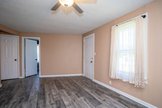 1421 N 4th Ave E, Newton, IA 50208 - unfurnished room featuring wood finished floors, ceiling fan, and a textured ceiling
