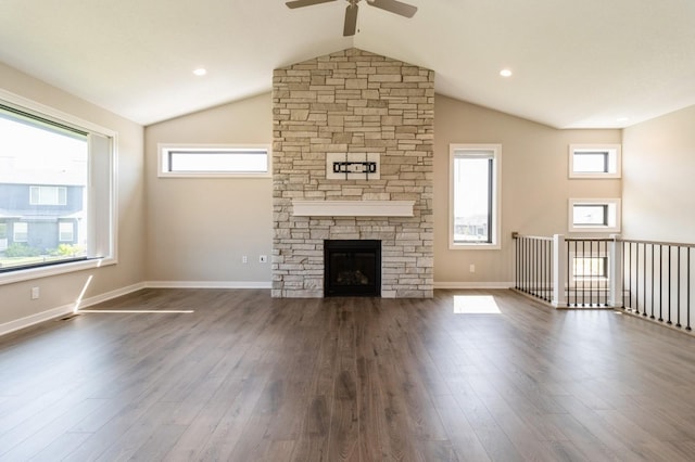 1809 12th St SE, Altoona, IA 50009 - unfurnished living room with a ceiling fan, lofted ceiling, dark wood finished floors, healthy amount of natural light, and a fireplace