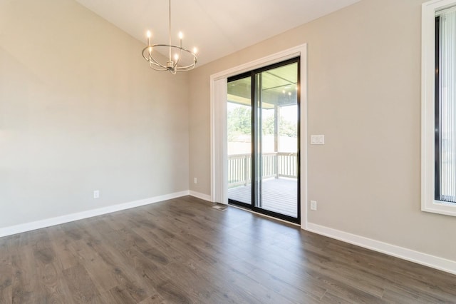 1809 12th St SE, Altoona, IA 50009 - unfurnished room with a chandelier, dark wood finished floors, and lofted ceiling