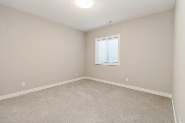 1809 12th St SE, Altoona, IA 50009 - spare room featuring carpet