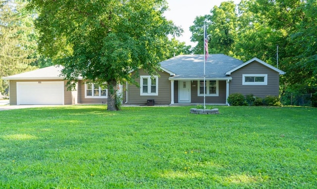 1600 Evergreen Ave, Des Moines, IA 50320 - ranch-style home with a garage, a front lawn, driveway, and covered porch