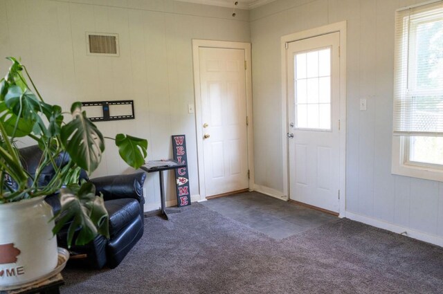 1600 Evergreen Ave, Des Moines, IA 50320 - entrance foyer featuring carpet floors and crown molding
