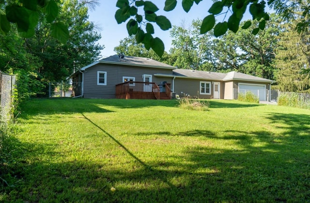 1600 Evergreen Ave, Des Moines, IA 50320 - rear view of property featuring a deck and an attached garage