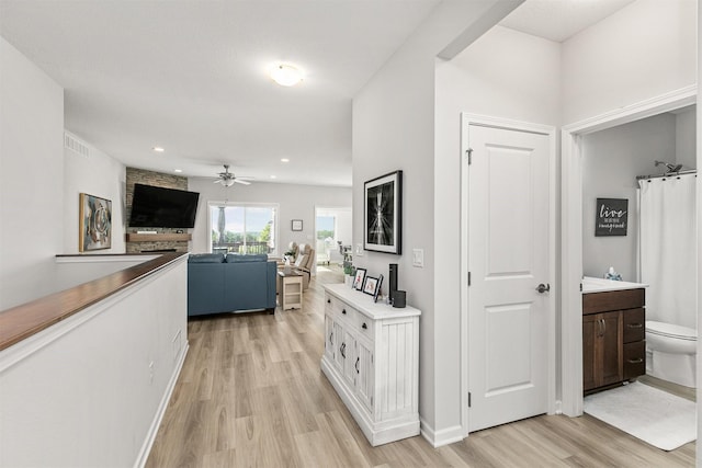 8932 Mockingbird Dr, West Des Moines, IA 50266 - hallway with light wood-type flooring and recessed lighting