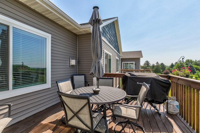 8932 Mockingbird Dr, West Des Moines, IA 50266 - wooden terrace featuring outdoor dining area and a grill