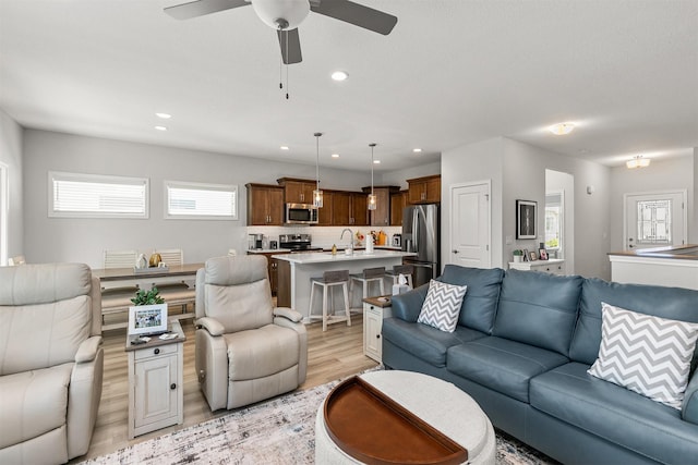 8932 Mockingbird Dr, West Des Moines, IA 50266 - living room featuring light wood-type flooring, a ceiling fan, and recessed lighting
