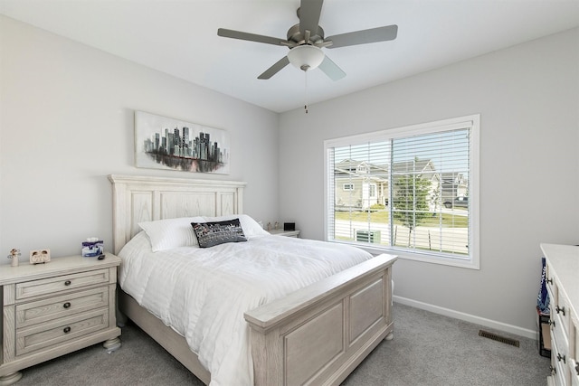 8932 Mockingbird Dr, West Des Moines, IA 50266 - bedroom featuring light colored carpet and a ceiling fan