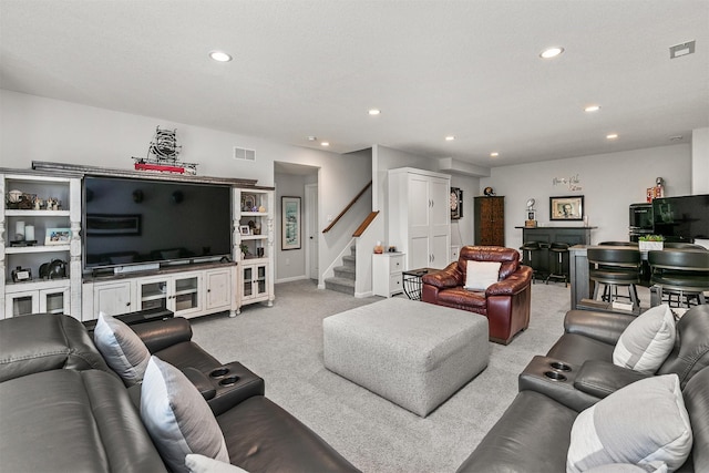 8932 Mockingbird Dr, West Des Moines, IA 50266 - carpeted living room with recessed lighting and stairway