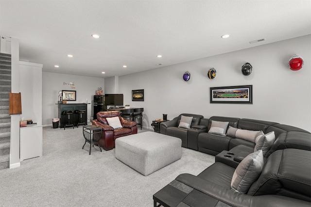 8932 Mockingbird Dr, West Des Moines, IA 50266 - living room featuring a bar, recessed lighting, stairway, and light colored carpet