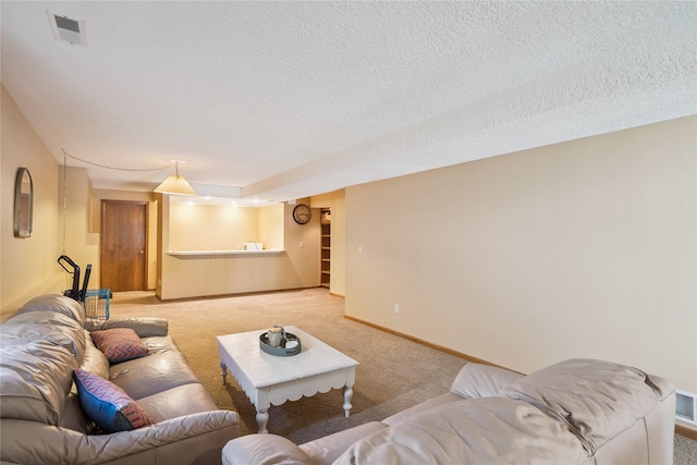 1123 SE Mallard Creek Dr, Ankeny, IA 50021 - living area featuring light colored carpet and a textured ceiling