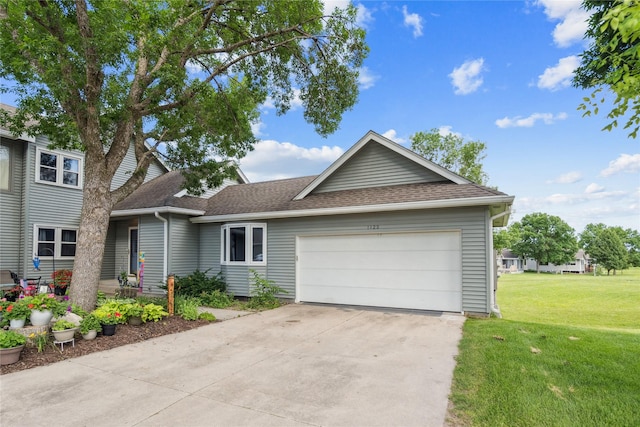 1123 SE Mallard Creek Dr, Ankeny, IA 50021 - view of front facade featuring an attached garage, a front lawn, a shingled roof, and concrete driveway