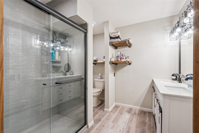 1123 SE Mallard Creek Dr, Ankeny, IA 50021 - bathroom with wood finished floors, vanity, and a stall shower