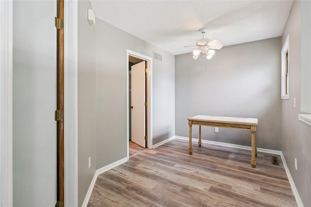 1123 SE Mallard Creek Dr, Ankeny, IA 50021 - empty room featuring ceiling fan and wood finished floors