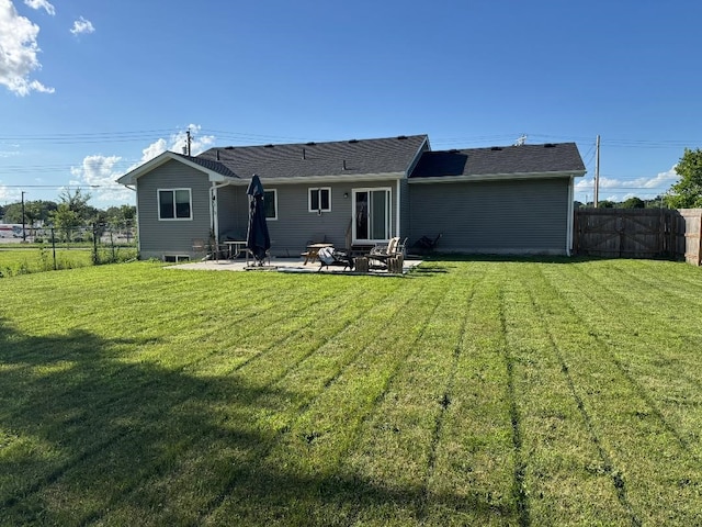 2625 Easton Blvd, Des Moines, IA 50317 - back of house with a patio area and a fenced backyard