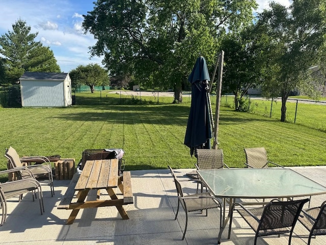 2625 Easton Blvd, Des Moines, IA 50317 - view of patio with a shed and outdoor dining space