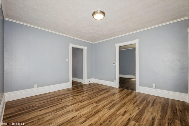 925 Laurel St, Des Moines, IA 50314 - empty room with crown molding and wood finished floors