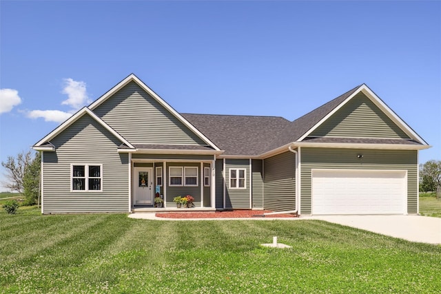 410 Sheridan St, Menlo, IA 50164 - view of front facade with an attached garage, a front lawn, concrete driveway, and a shingled roof