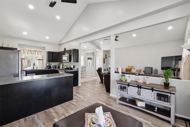 410 Sheridan St, Menlo, IA 50164 - kitchen featuring appliances with stainless steel finishes, a ceiling fan, a peninsula, light countertops, and recessed lighting