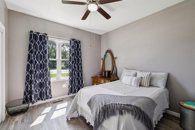 410 Sheridan St, Menlo, IA 50164 - bedroom with wood finished floors and ceiling fan