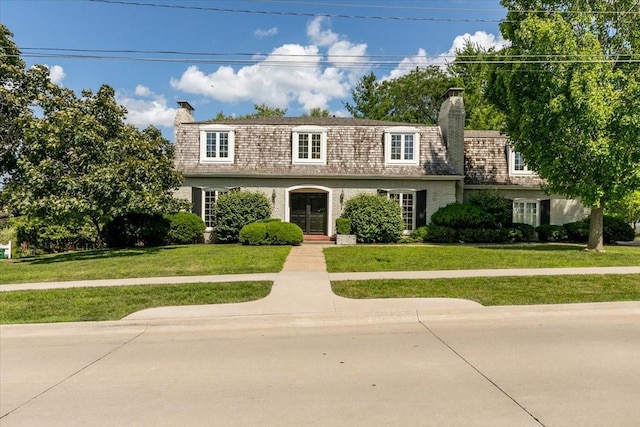 7819 Luin Ln, Windsor Heights, IA 50324 - view of front property featuring a chimney, a front yard, and mansard roof