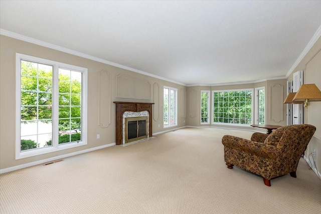 7819 Luin Ln, Windsor Heights, IA 50324 - living room with ornamental molding, light carpet, and a fireplace
