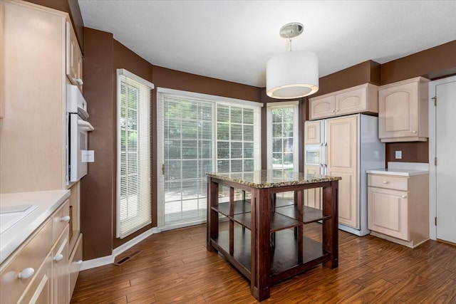 7819 Luin Ln, Windsor Heights, IA 50324 - kitchen featuring paneled fridge, oven, dark wood-type flooring, and white cabinets