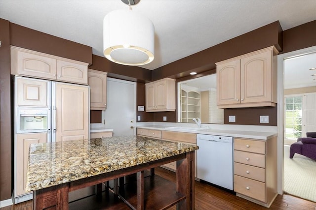 7819 Luin Ln, Windsor Heights, IA 50324 - kitchen with dishwasher, dark wood-type flooring, paneled refrigerator, and a kitchen bar
