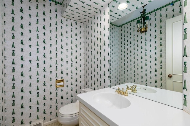 7819 Luin Ln, Windsor Heights, IA 50324 - half bath with wallpapered walls and vanity