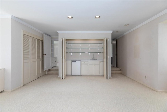 7819 Luin Ln, Windsor Heights, IA 50324 - unfurnished living room with light colored carpet, ornamental molding, and recessed lighting