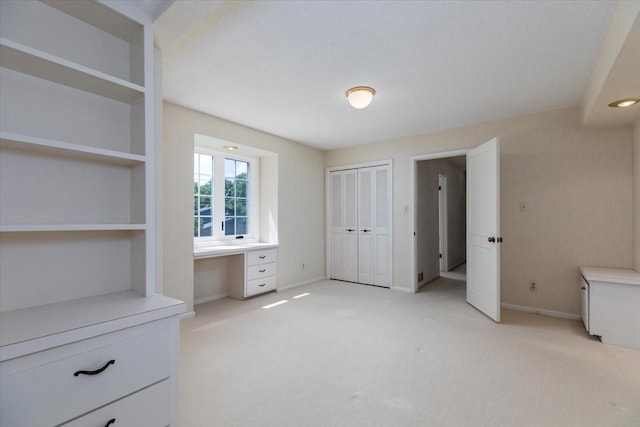 7819 Luin Ln, Windsor Heights, IA 50324 - unfurnished bedroom with light colored carpet and a closet