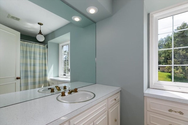7819 Luin Ln, Windsor Heights, IA 50324 - bathroom with vanity and a shower with curtain