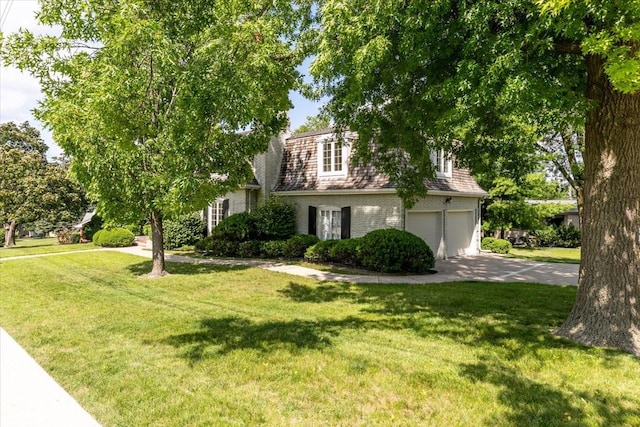 7819 Luin Ln, Windsor Heights, IA 50324 - view of front facade with driveway, a front lawn, and a garage
