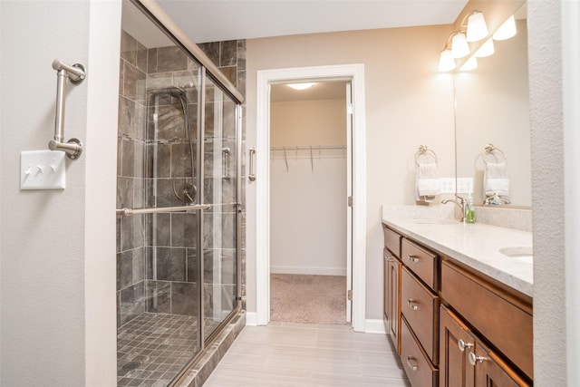 2801 SW Prairie Trail Pkwy, Ankeny, IA 50023 - full bath featuring double vanity, a stall shower, and a spacious closet