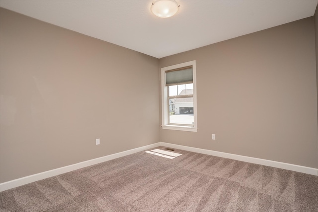 2801 SW Prairie Trail Pkwy, Ankeny, IA 50023 - carpeted empty room with baseboards