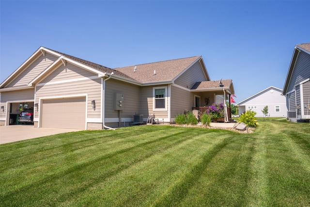 2801 SW Prairie Trail Pkwy, Ankeny, IA 50023 - view of front of house with an attached garage, a front yard, driveway, and roof with shingles