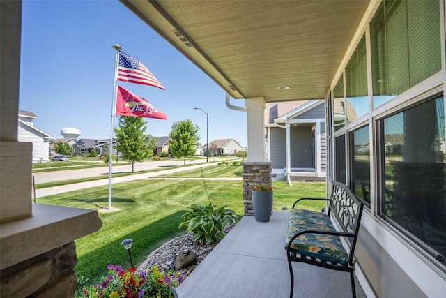2801 SW Prairie Trail Pkwy, Ankeny, IA 50023 - covered porch featuring a residential view and a lawn