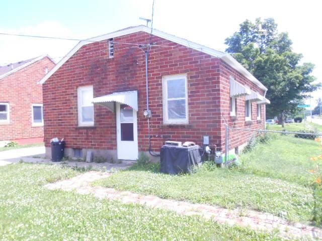 702 Woodbury St, Marshalltown, IA 50158 - rear view of property with brick siding