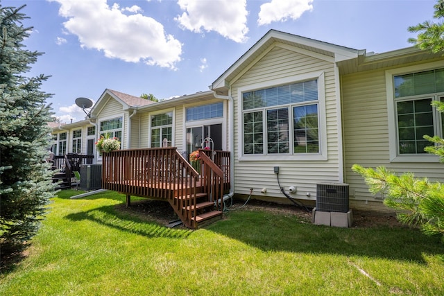 1745 Waters Edge Dr, Pleasant Hill, IA 50327 - rear view of property featuring a deck and a lawn