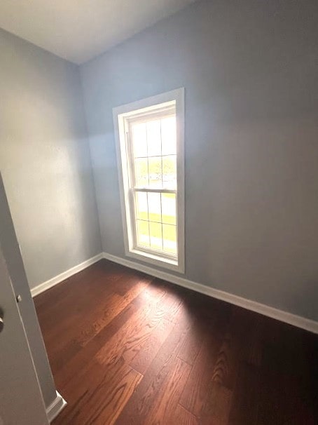 426 N 1st St, Ogden, IA 50212 - unfurnished room with dark wood-style flooring and baseboards