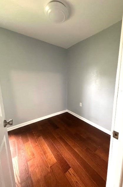 426 N 1st St, Ogden, IA 50212 - spare room with baseboards and dark wood-type flooring