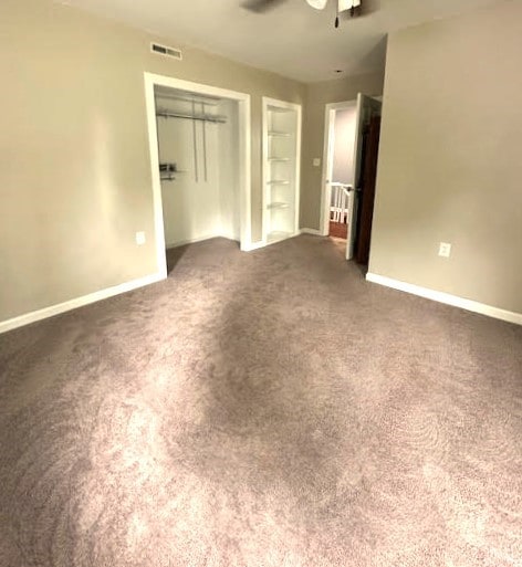 426 N 1st St, Ogden, IA 50212 - unfurnished bedroom with carpet floors, a closet, and ceiling fan